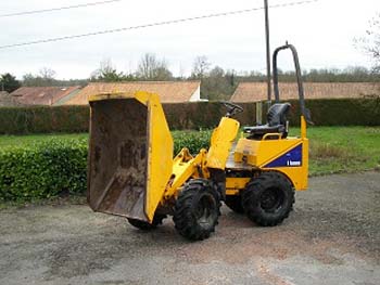 yellow hi tip dumper on a gravel road