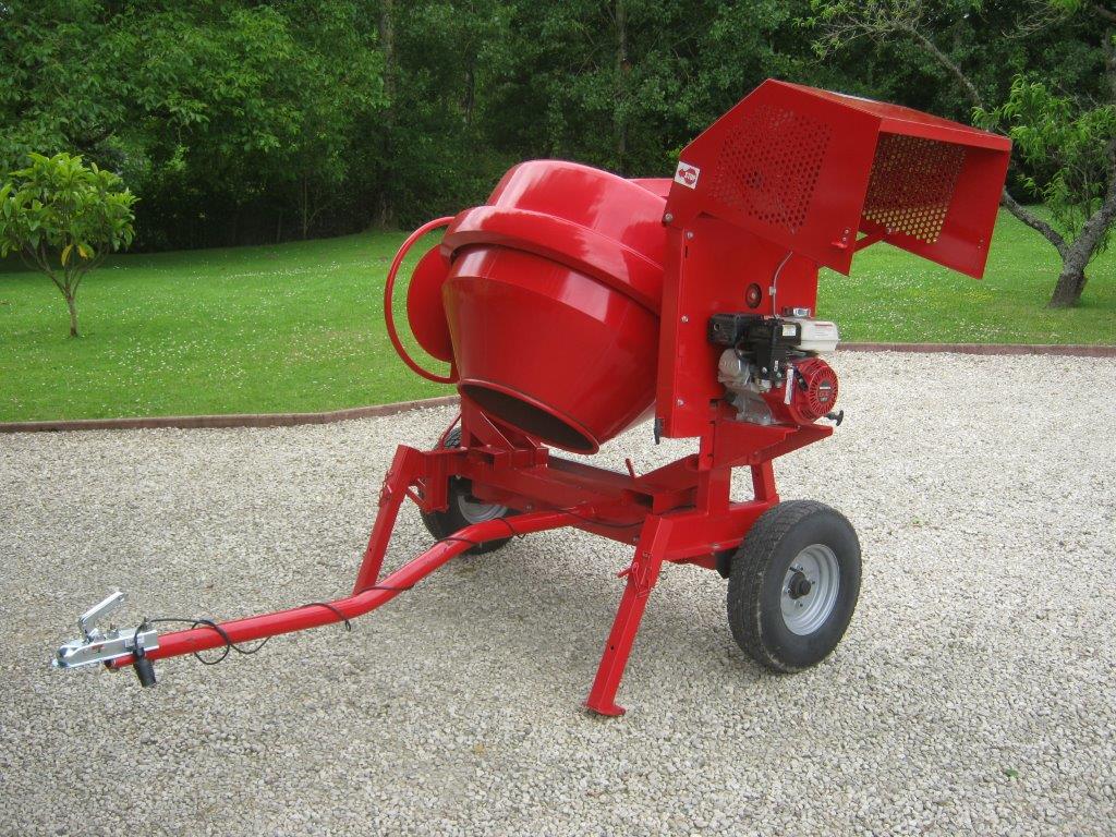 red coloured industrial cement mixer with an arm for towing