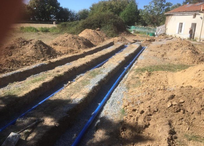 three trenches dug out using a mini-pelle, and pipes laid inside