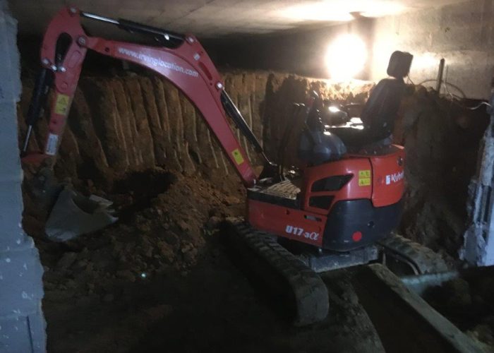Kubota mini-dgger digging out a basement near Bressuire