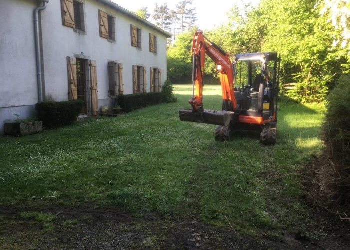 mini digger in garden ready to dig a hole