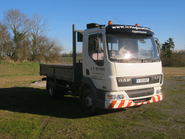 white tipper truck with J.P.Irving logo on the side